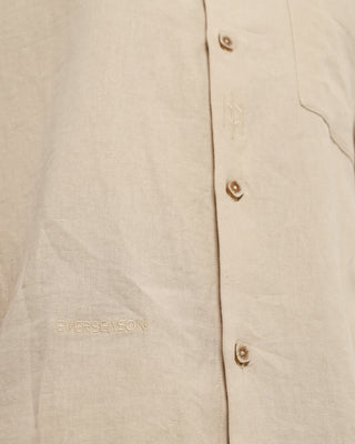 Beige shirt with 'Everseason' branding on a beige background