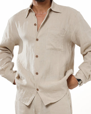 Man wearing a beige Everseason button-up 100% linen shirt with a white background