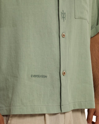 Green shirt with 'EVERSEASON' branding on a plain background