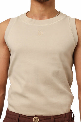 Beige sleeveless Everseason shirt worn by a person on a white background