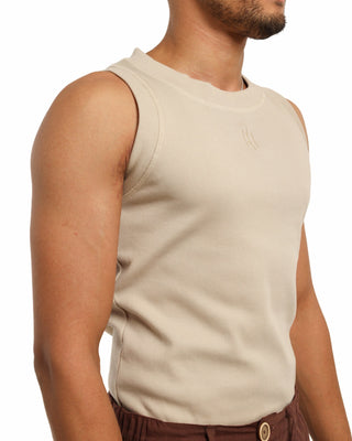 Beige sleeveless Everseason shirt worn by a person on a white background